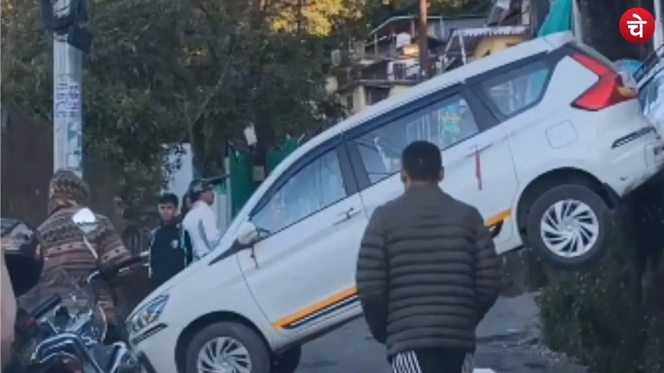 Car falls from hotel parking onto the road in Nainital